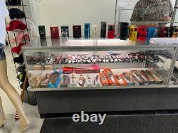 Multiple Lighted Glass Display Cases withShelves Various Sizes And Styles