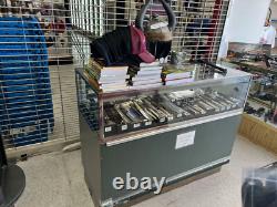 Multiple Lighted Glass Display Cases withShelves Various Sizes And Styles
